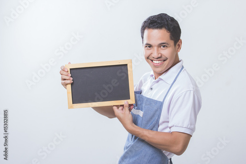 Small business shop owner with black board