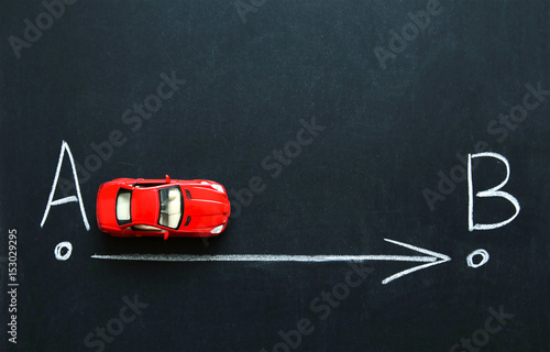 From point A to point B on the car. Drawing chalk on a black board. Vintage
