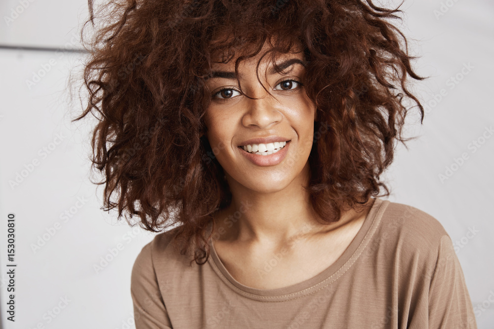 Beautiful african girl smiling looking at camera. Beautiful african girl smiling looking at camera.