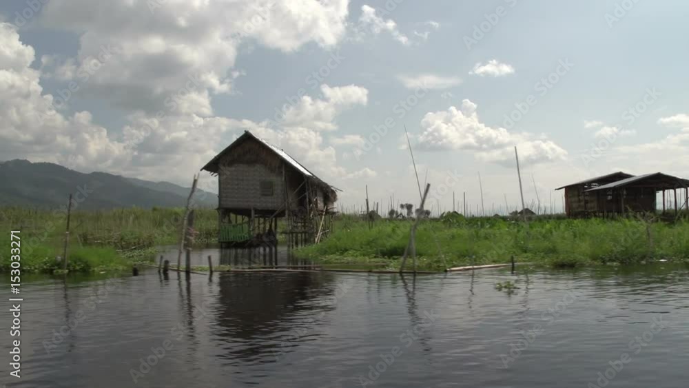 Inle lake, Cruising waterway with houses on stilts Inle lake, Cruising waterway with houses on stilts