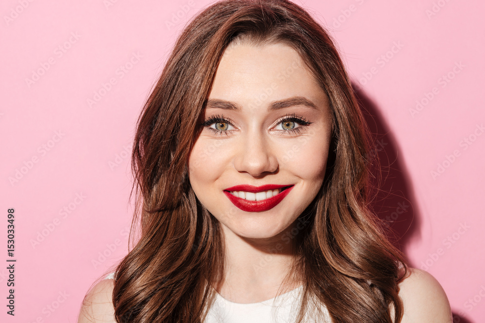 Smiling young brunette lady looking at camera Smiling young brunette lady looking at camera