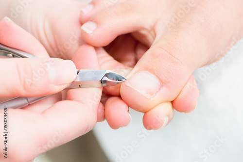 Nipping cuticles at pedicure salon