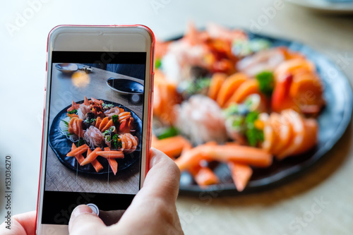 using mobile smart phone Taking photo sashimi