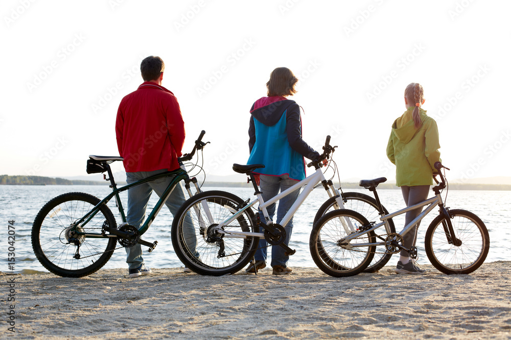Biker family silhouette. Happy family on bikes Biker family silhouette. Happy family on bikes