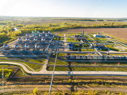 tank farm for bulk petroleum and gasoline storage next to rail line. Aerial view