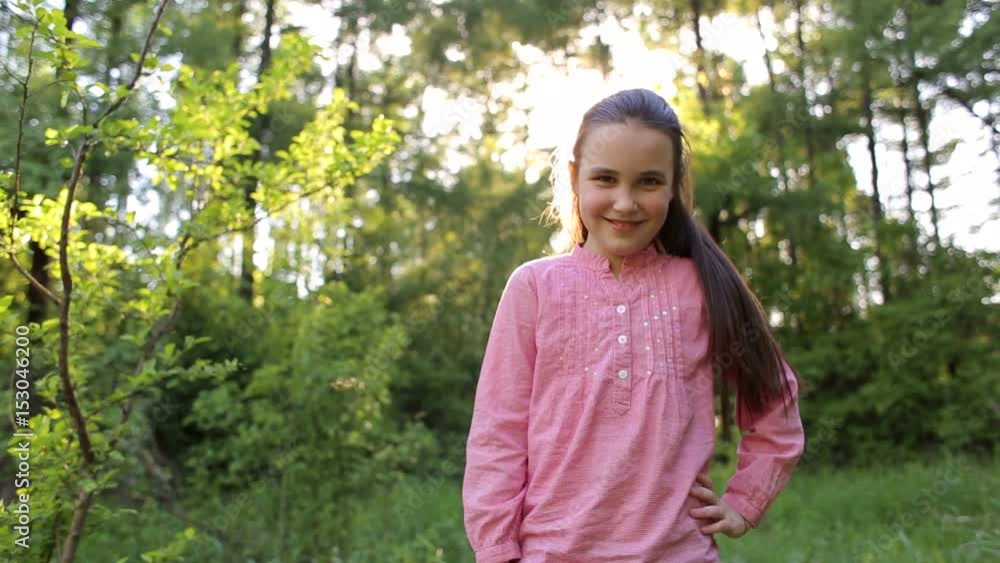 Portrait of happy smiling little girl at sunset in the woods. Portrait of happy smiling little girl at sunset in the woods.