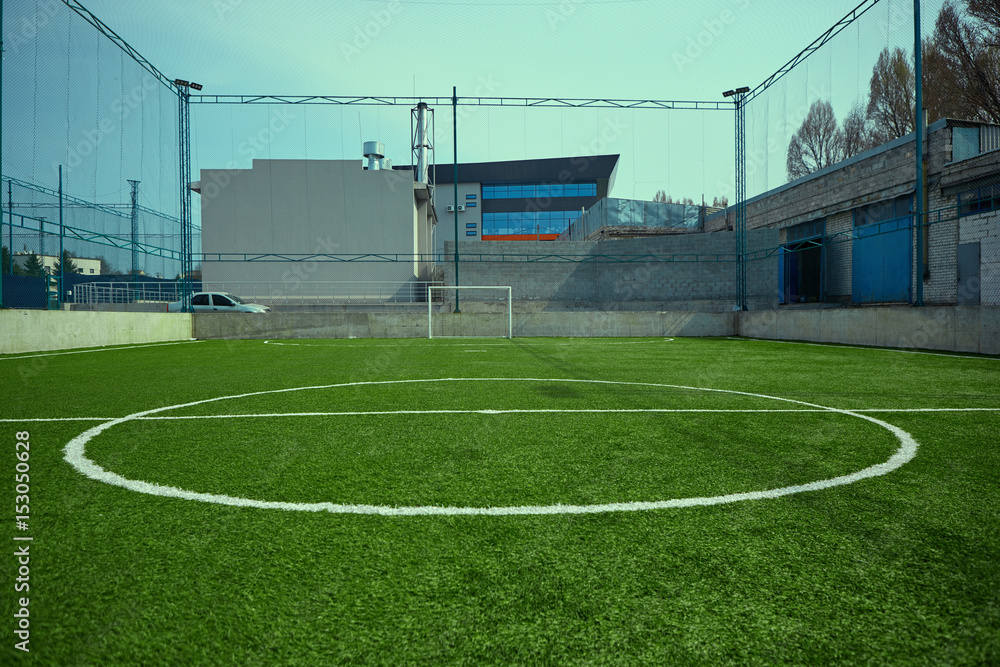 Fototapeta premium The empty football field and green grass