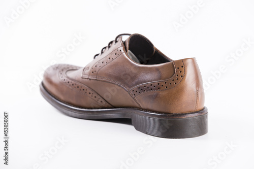 Male Brown Shoes Leather on White Background, Isolated Product, Top View, Studio.