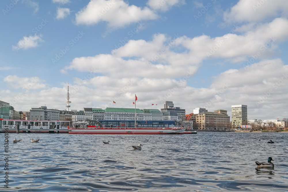 low level shot of Alster Lake in Hamburg, Germany with Jungfernstieg in background
