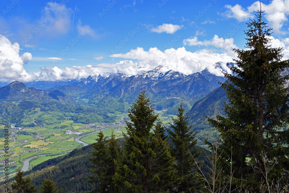 Snow-capped mountains and valley with river (Salzach) in Austria. Photo taken from Rossfeldstrasse panorama road on German Alps near Berchtesgaden, Bavaria, Germany.