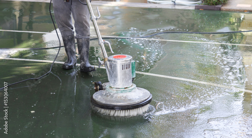 cleaning the floor with polishing machine