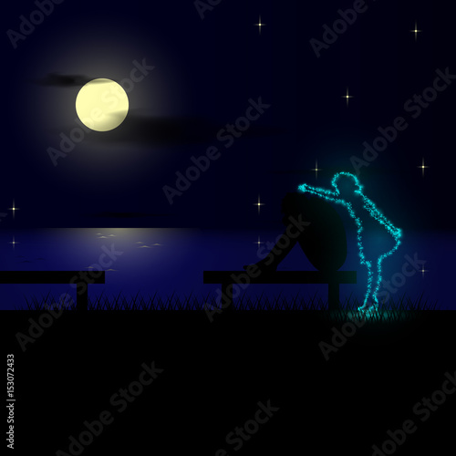 Sad man sitting on the bench of the beach at night and misses his mother.