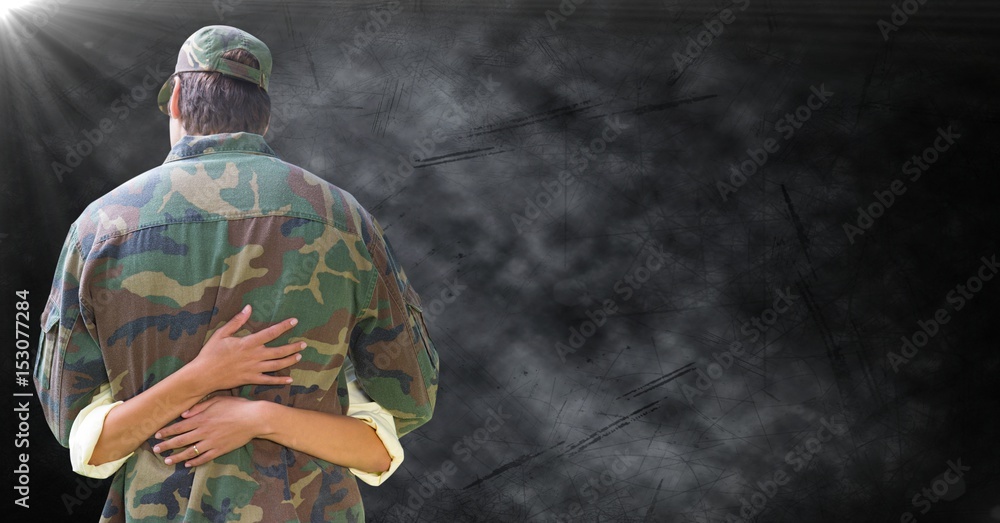 Back of soldier being hugged Back of soldier being hugged