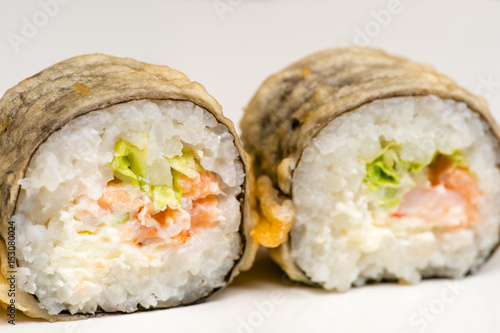 two beautiful sushi roll closeup isolated on gray background