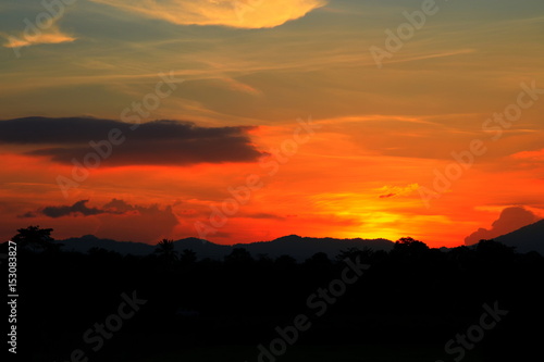 sunset beautiful and silhouette mountain tree woodland colorful landscape in sky twilight time