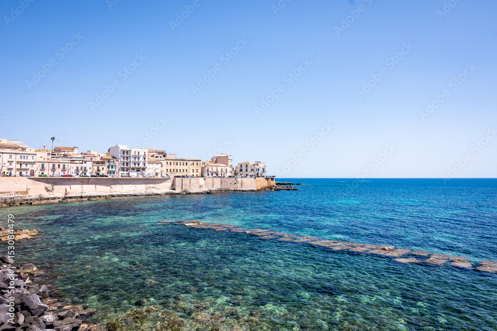 Seafront view of Ortygia isle on Ionian Sea, Syracuse city, Sicily Island in Italy.