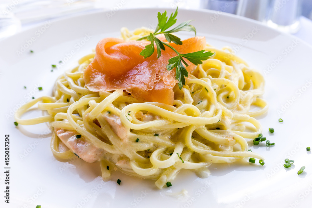 tasty pasta with salmon on a the table tasty pasta with salmon on a the table