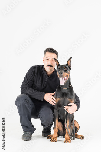 Yound male posing with his dog photo