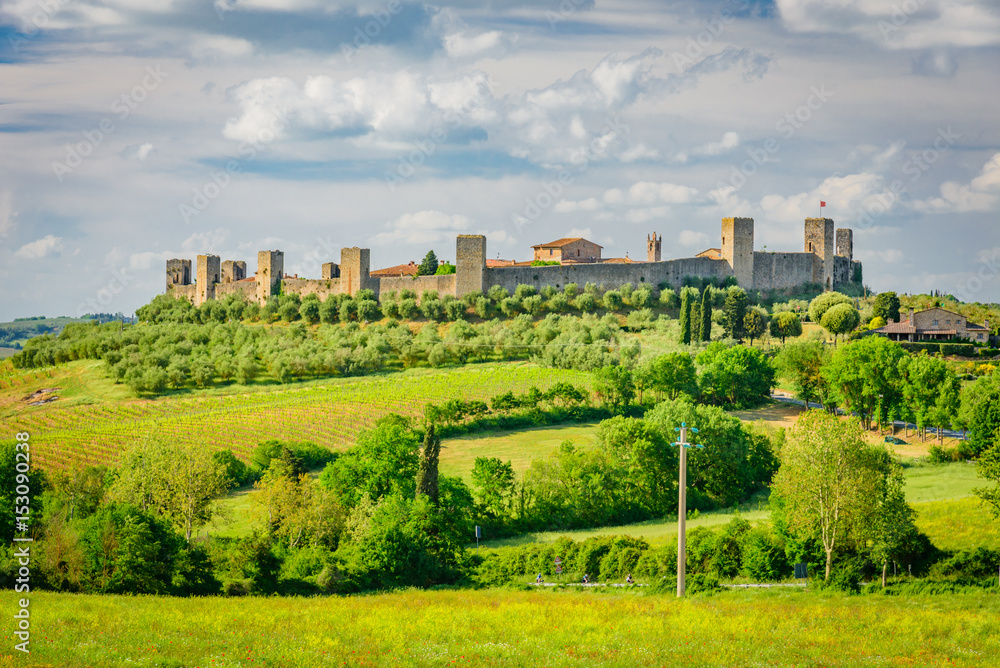 View of the medieval castle town of Monteriggioni in the hills of Siena in Tuscany