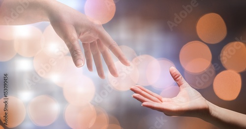 Close-up of woman's hand reaching man 