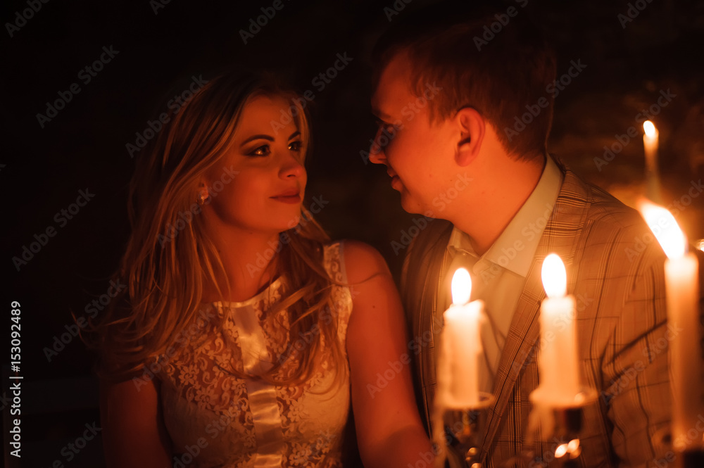 Romantic dinner of a young couple by candlelight in the mountains Romantic dinner of a young couple by candlelight in the mountains