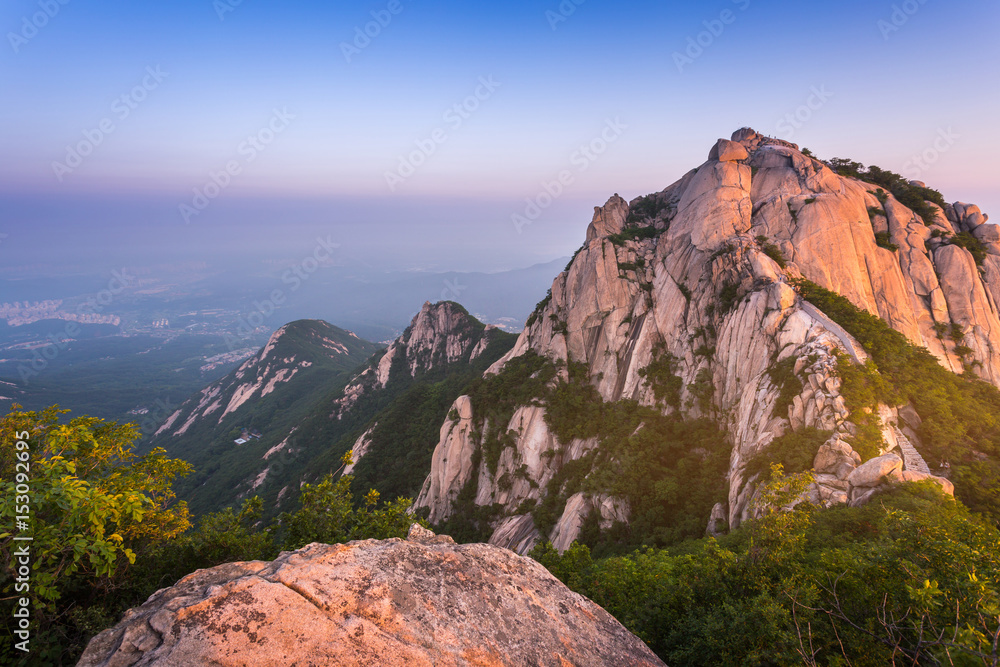mountain in korea at sunrise located in gyeonggido seoul, south korea. the name of mountain 'Bukhansan'