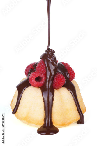 Small Raspberry Angelfood Cake with Melted Chocolate Pouring On Top photo