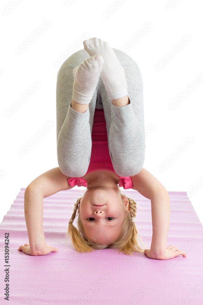 little girl standing on her hand isolated on white. Stock Photo | Adobe ...