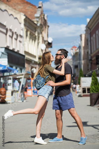 romantic couple in love embrace, kiss and dance in street