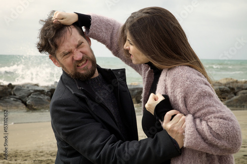 Woman hitting husband pulling hair violence