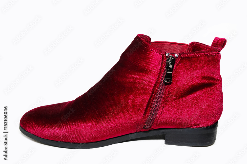 Lady's red velvet ankle boots isolated on white background. Lady's red velvet ankle boots isolated on white background.