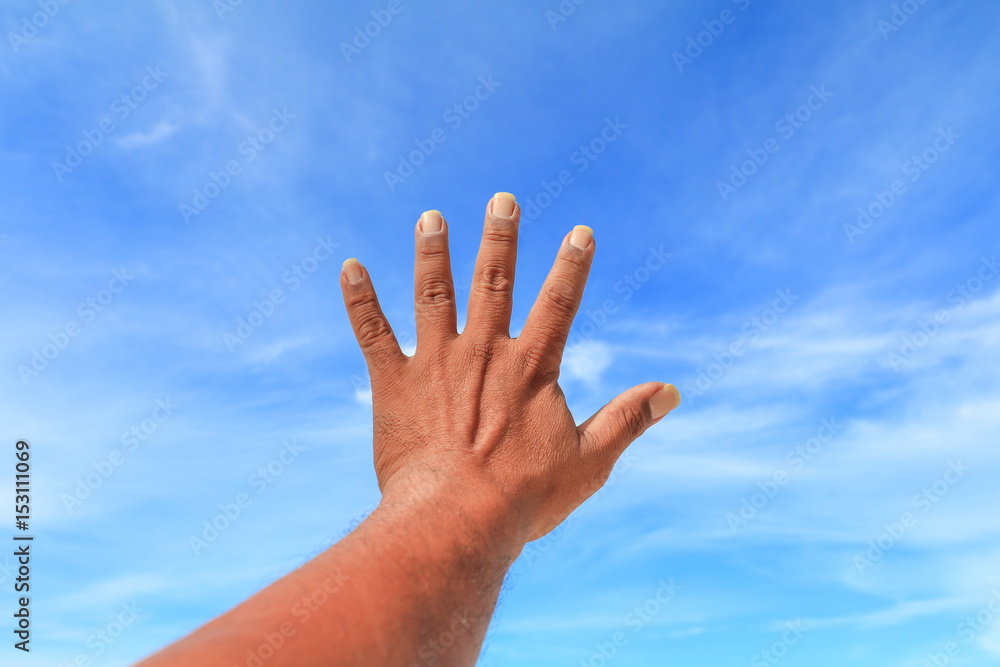 hand show counting number five on sky background hand show counting number five on sky background