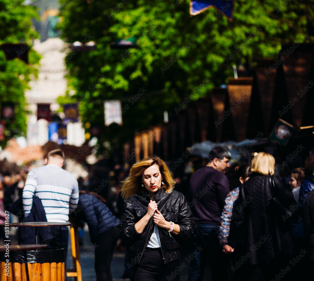 The stylish girl walking along street The stylish girl walking along street