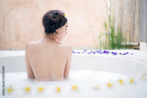 Woman bathing in a spa bath
