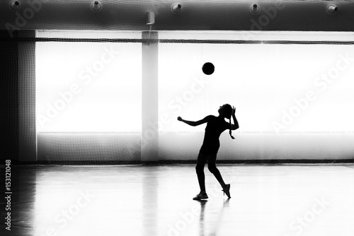 Girl playing volleyball in the sports club