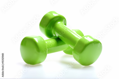 Dumbbells in green color isolated on white