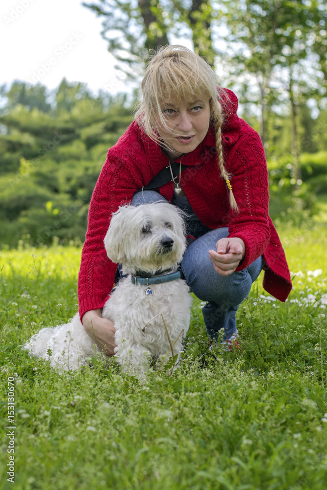Woman with a dog in the park Woman with a dog in the park