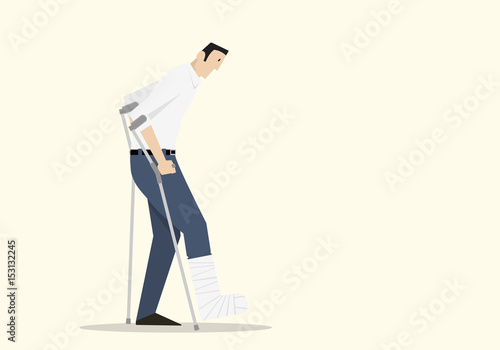 Male accident victim walking with crutches, with his leg in plaster cast.