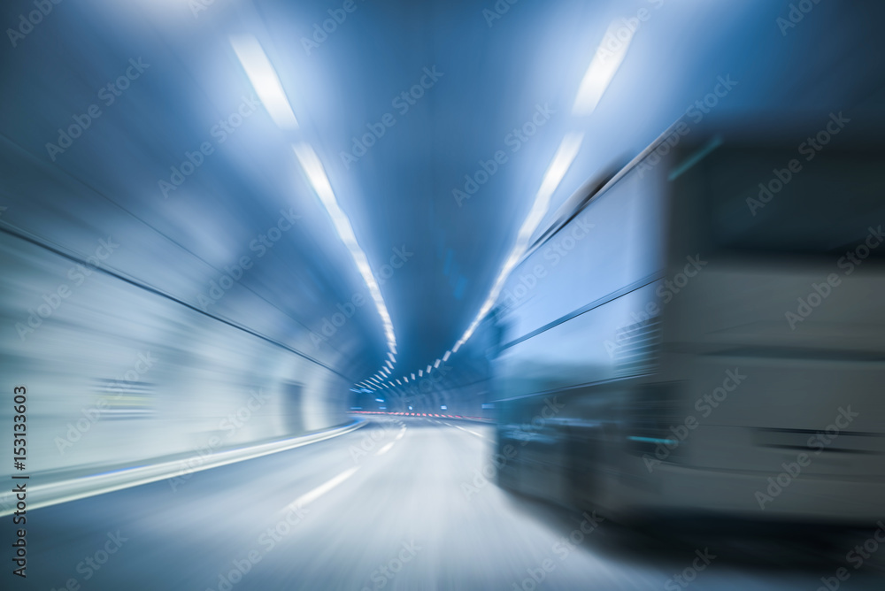 Bus in the tunnel, blue toned image.Speed Concept