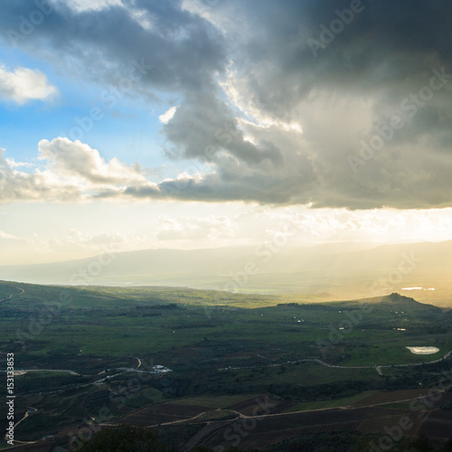 Magnificent view of the Golan Heights  the rays of the setting sun make their way through the clouds