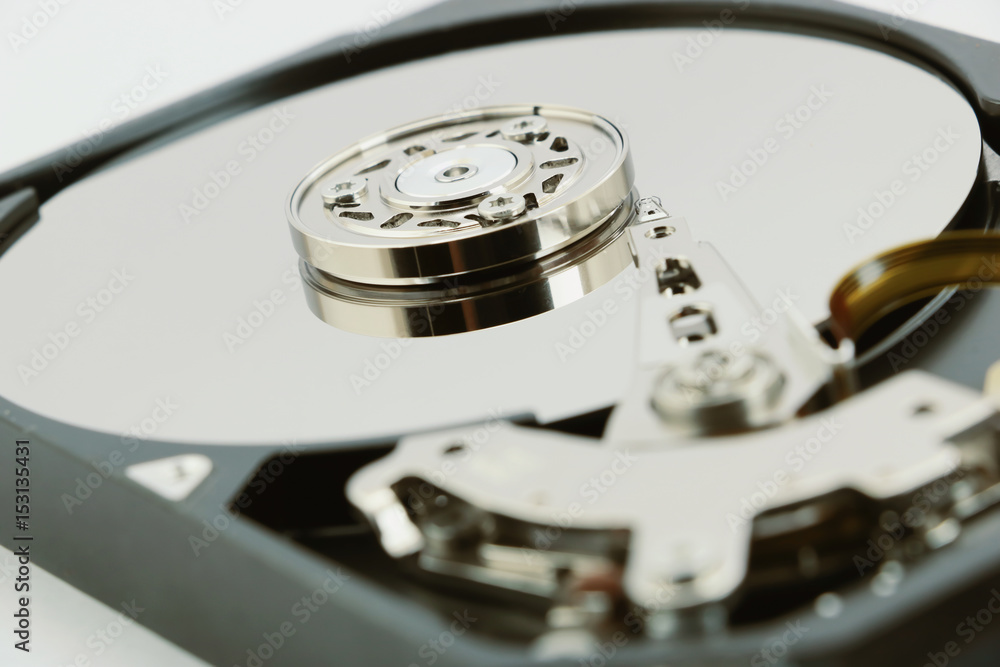 Open cover harddisk and harddisk back - harddisk drive is the data storage for the digital data where is in the your computer isolate on white Open cover harddisk and harddisk back - harddisk drive is the data storage for the digital data where is in the your computer isolate on white