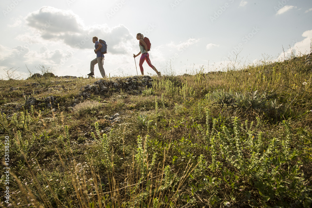 © BGStock72 - Couple hiking in the mountains