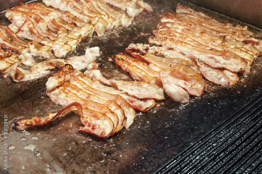 Grill the bacon on a hot fireplace.