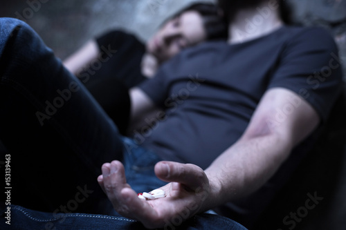 Homeless obsessed couple using drugs in the dark place