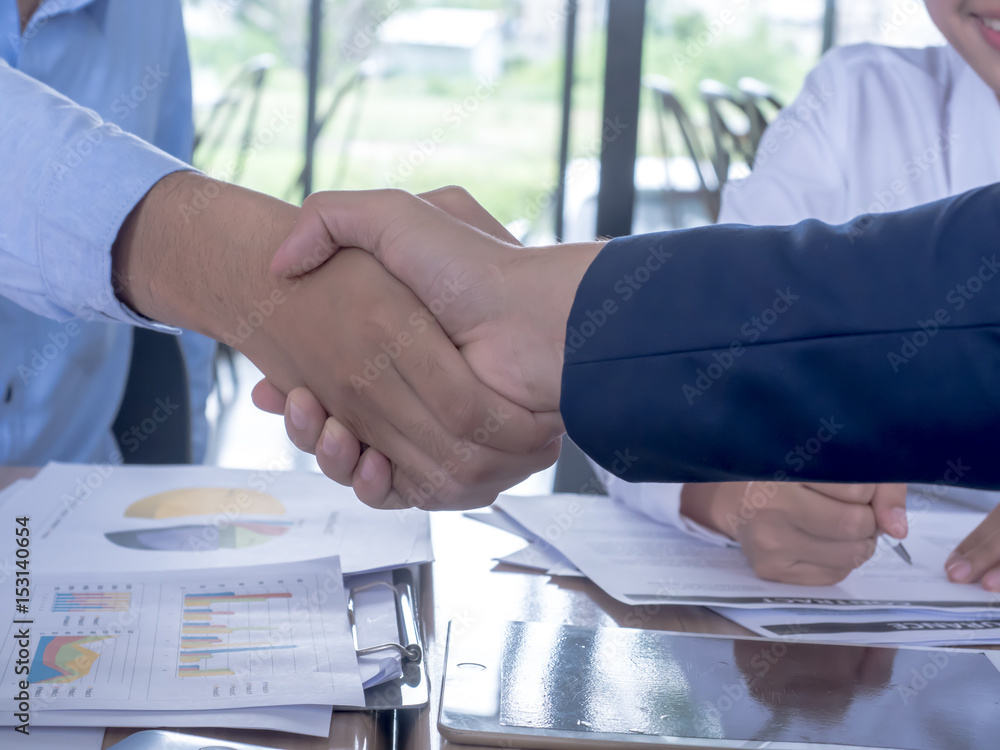 Business people shaking hands, finishing up a meeting Business people shaking hands, finishing up a meeting