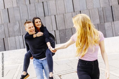 Young students having fun o...