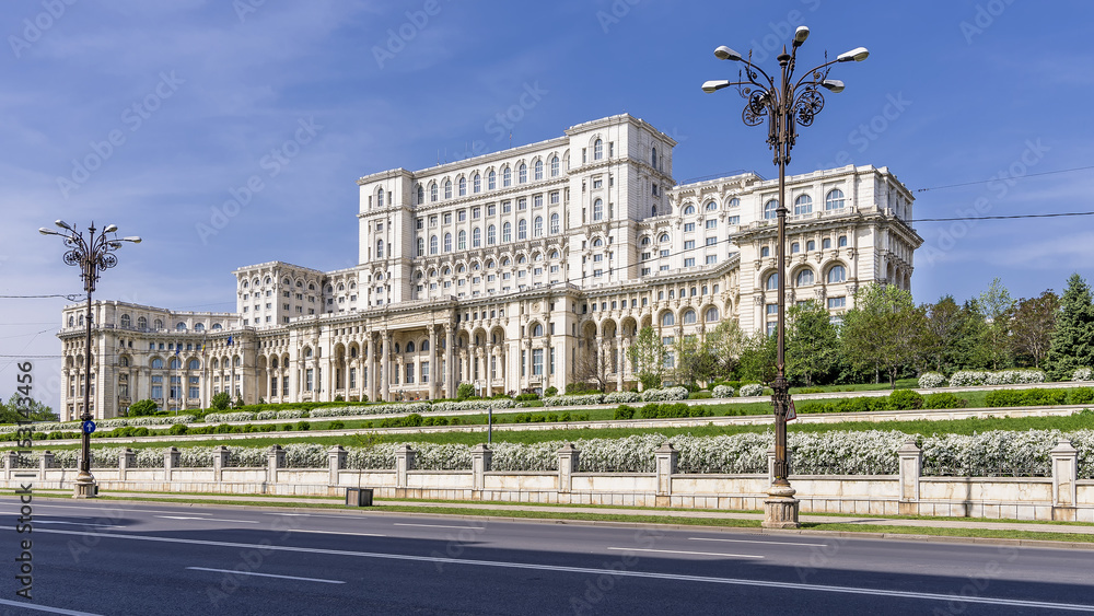 The facade of the imposing Parliament Building in Bucharest, Romania, on a sunny day