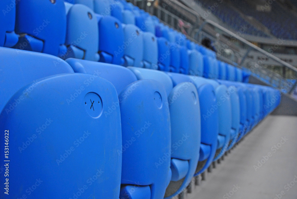 Fototapeta premium Blue seats in the stadium. Spectator places