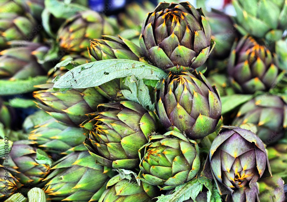 Fototapeta premium Pile of Artichoke on display at a farmers market
