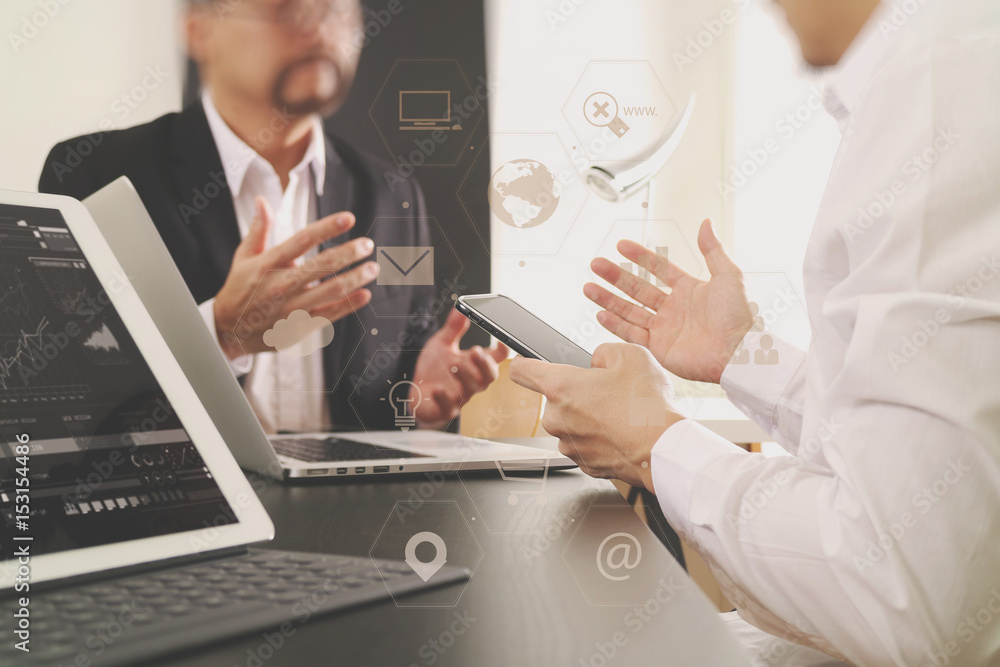 Co working team meeting concept,businessman using smart phone and digital tablet and laptop computer in modern office Co working team meeting concept,businessman using smart phone and digital tablet and laptop computer in modern office